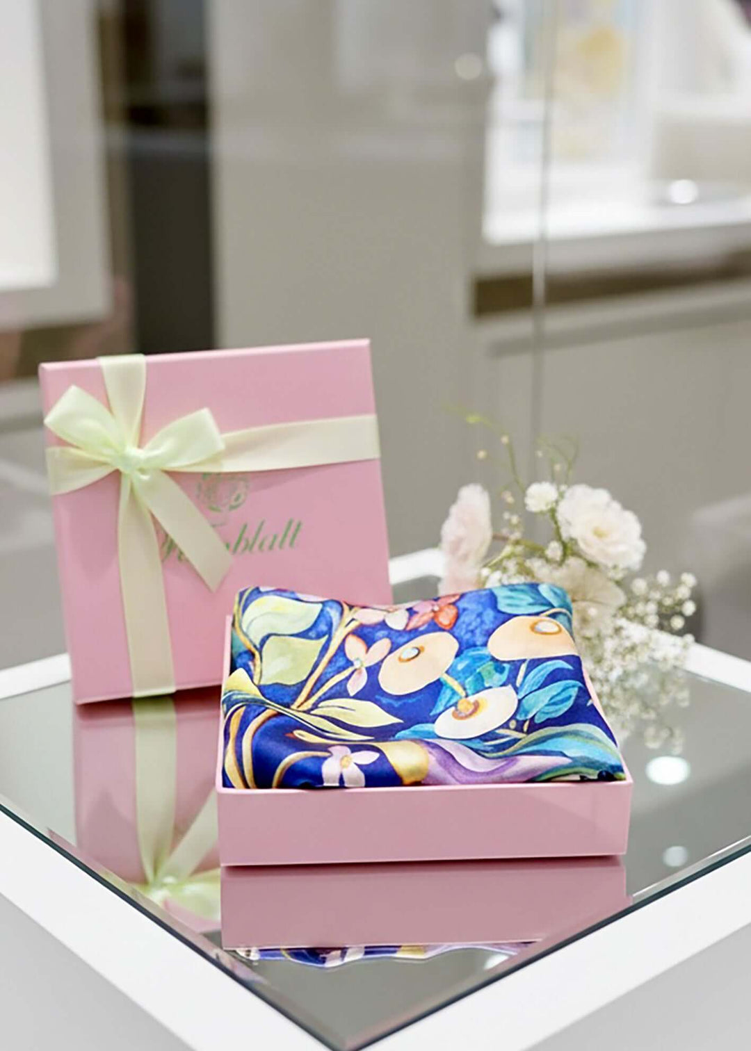 Designer Silk Scarf Summer Garden Violet, Hearts elegantly presented in a pink gift box with a ribbon.