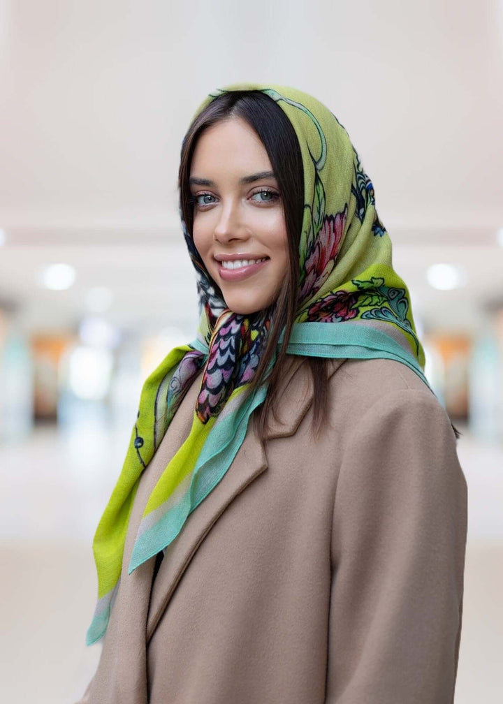 Model wearing a vibrant yellow Kashmiri scarf styled elegantly in a modern setting.