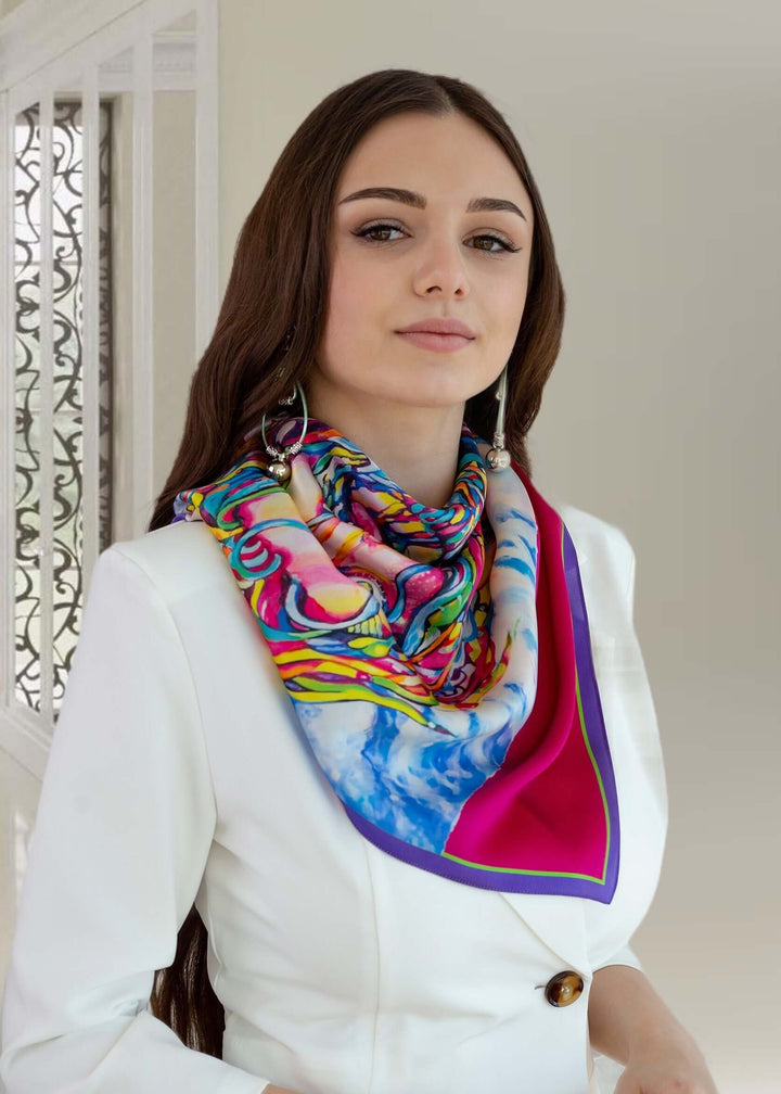 Fuchsia silk scarf Power by Iryna Feinblatt, worn stylishly, showcasing bold colors and patterns.