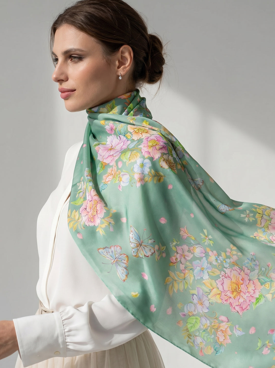 Luxury mint green silk scarf flowing in motion with delicate floral design